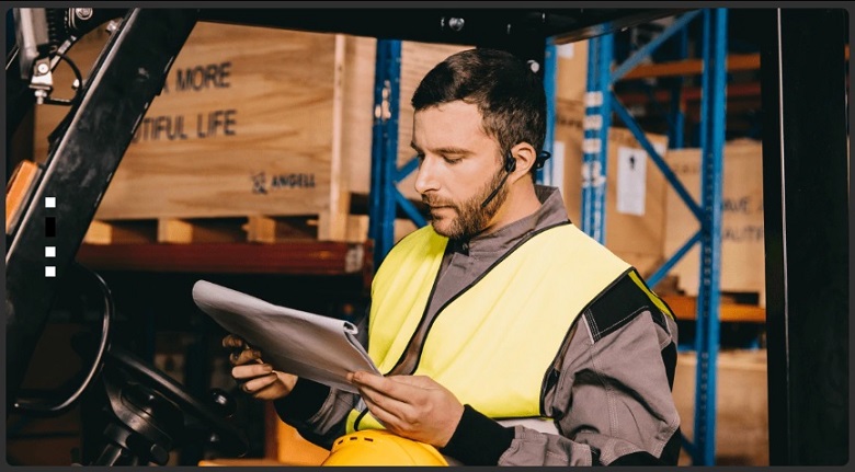 person working in a loud and noisy factory while wearing bone conduction headphone