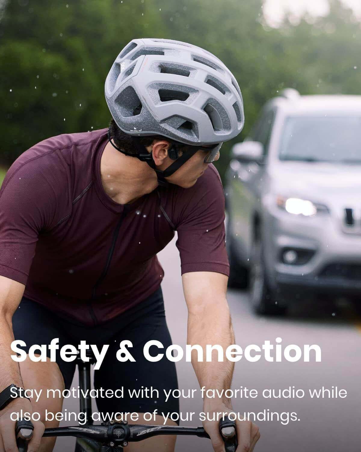 man wearing shokz openrun pro offering safety while cycling outdoors with a moving vehicle behind
