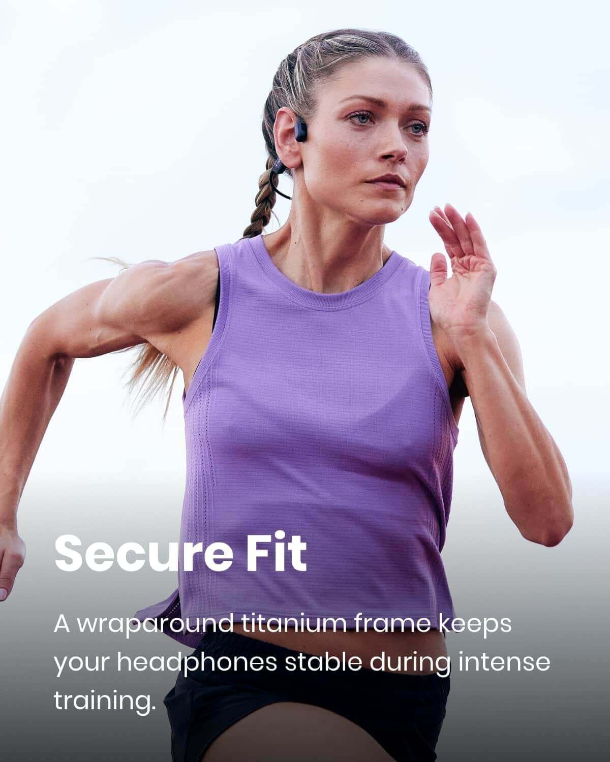 shokz openrun pro fitting securely on the head of a woman running outdoors